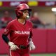 Oklahoma's Rylie Boone (0) runs to first base after a walk during the college softball game between the University of Oklahoma Sooners and Texas A&M Commerce at Love's Field in Norman, Okla., Wednesday, March 6, 2024.